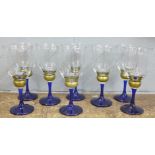A set of eight blue stemmed wine glasses
