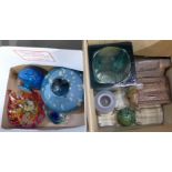 A collection of coloured glass, three faceted glass paperweights and two ceramic Thorntons money