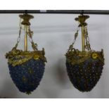 Two similar French style gilt metal and coloured glass chandeliers, 50cms h