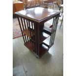 An Edward VII inlaid mahogany revolving bookcase