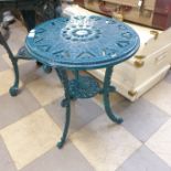A painted cast iron garden table