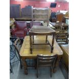 An oak draw-leaf table, four chairs and a trolley