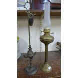 A brass oil lamp and an early gas fitting