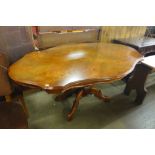 An Italian Sorrento walnut and marquetry effect dining table