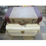 A painted tin steamer trunk and a vintage suitcase