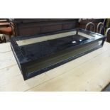 A table top ebonised display cabinet