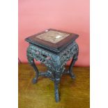 A Chinese marble topped padouk jardiniere stand, 49cms h