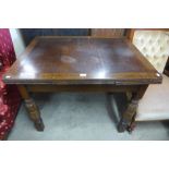 An oak draw-leaf table