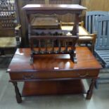 A mahogany coffee table and magazine rack