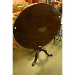 A George III mahogany circular tilt-top tea table