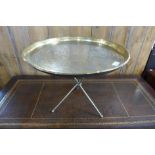 An eastern brass circular occasional table