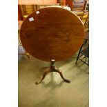 A George III mahogany circular tilt-top tea table