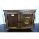 An oak table top two door cabinet, bearing painted King Edward Cigars inscription
