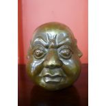 A small bronze four faced Buddha, 11cms h