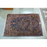 An Afghan Belouch blue ground rug, 137 x 87cms