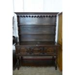 A Jacobean Revival oak geometric moulded dresser