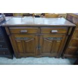An Arts and Crafts oak sideboard