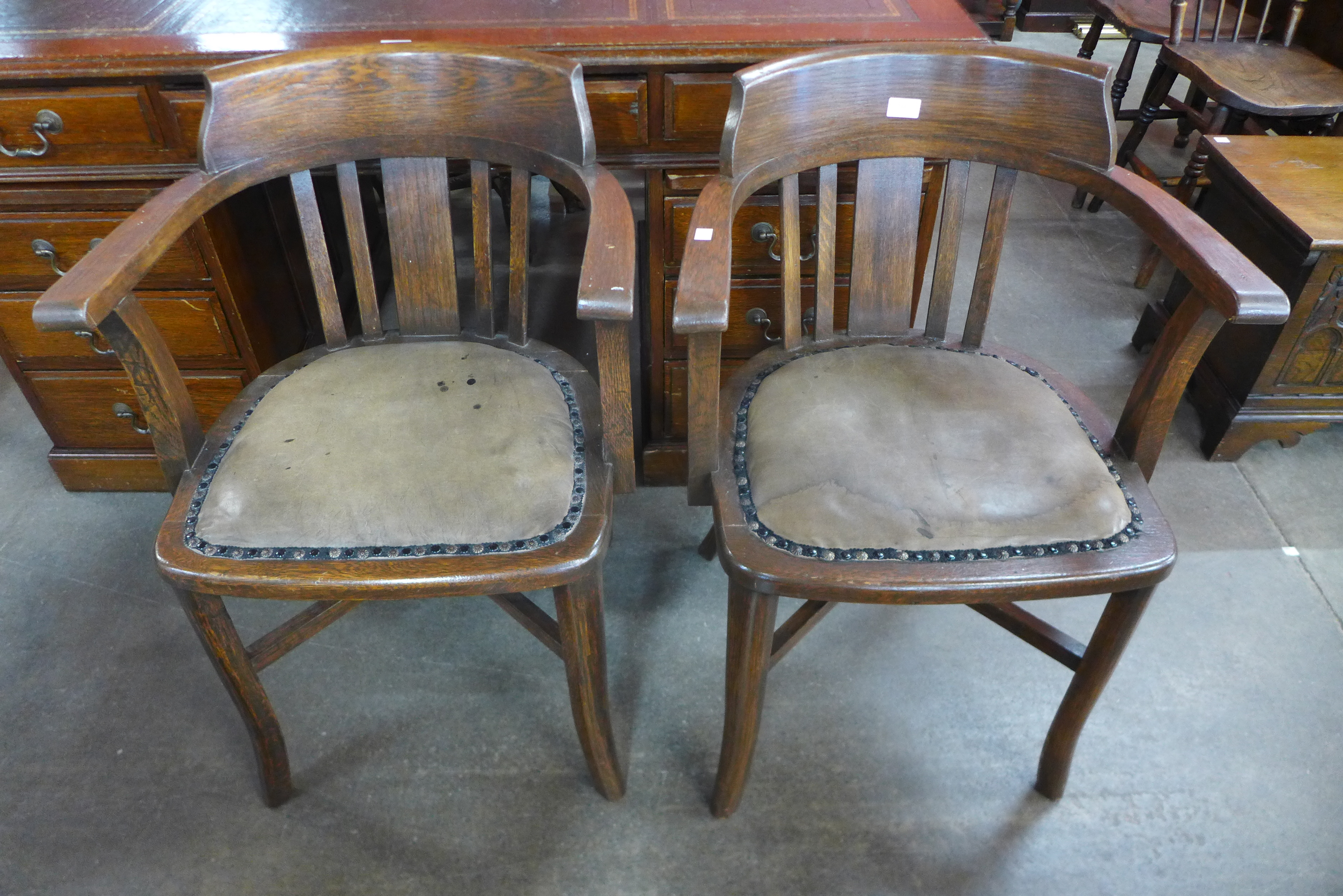 A pair of Victorian oak desk chairs