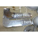 A pair of illuminated Order Here signs