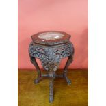 A Chinese marble topped padouk jardiniere stand, 61cms h