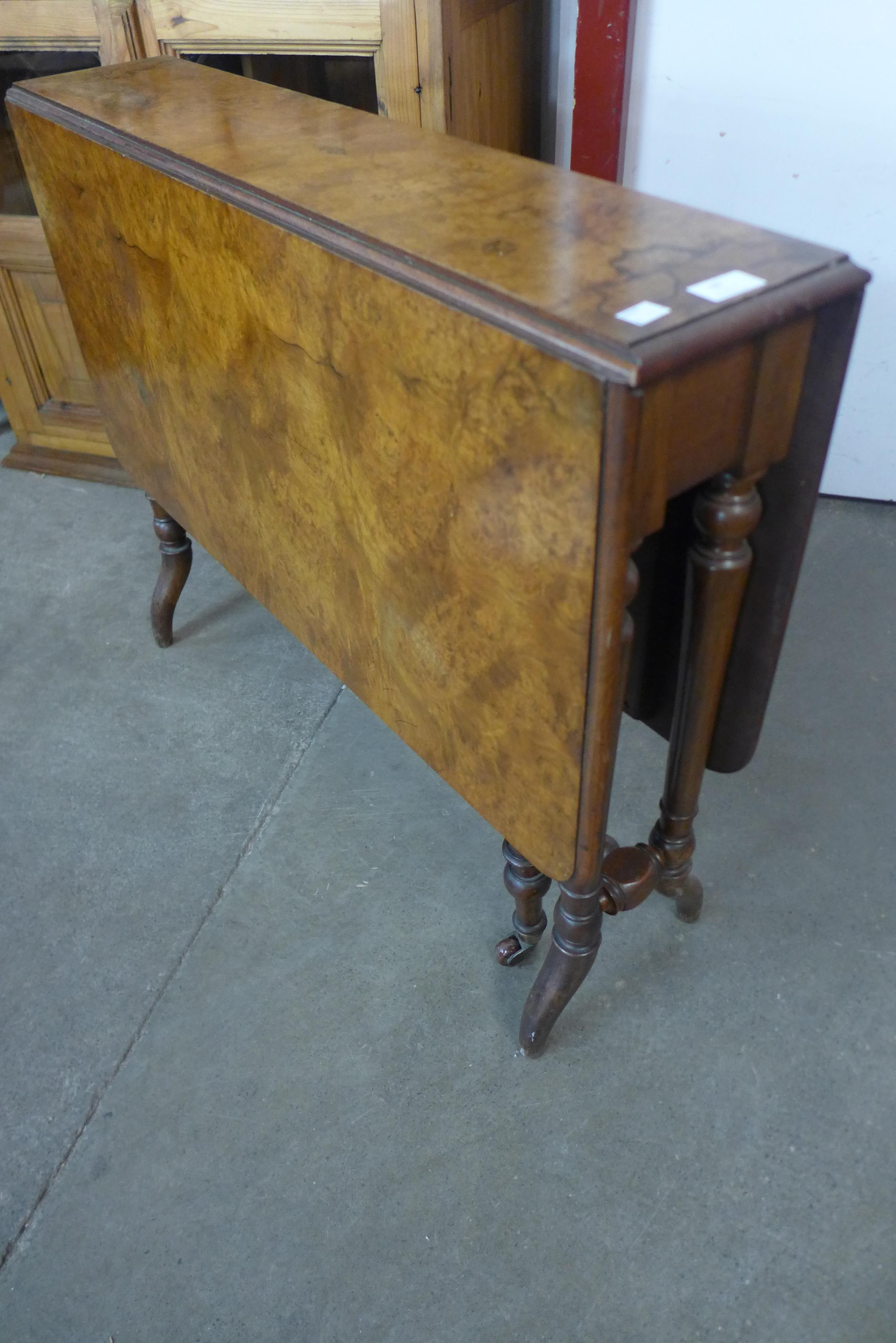 A Victorian walnut Sutherland table