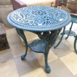 A painted cast iron garden table