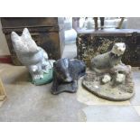 Three concrete garden figures, two badgers and a fox