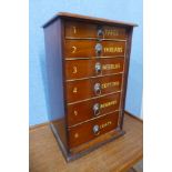 A mahogany counter top six drawer haberdashery chest, bearing Clark & Co. Anchor Mills inscription