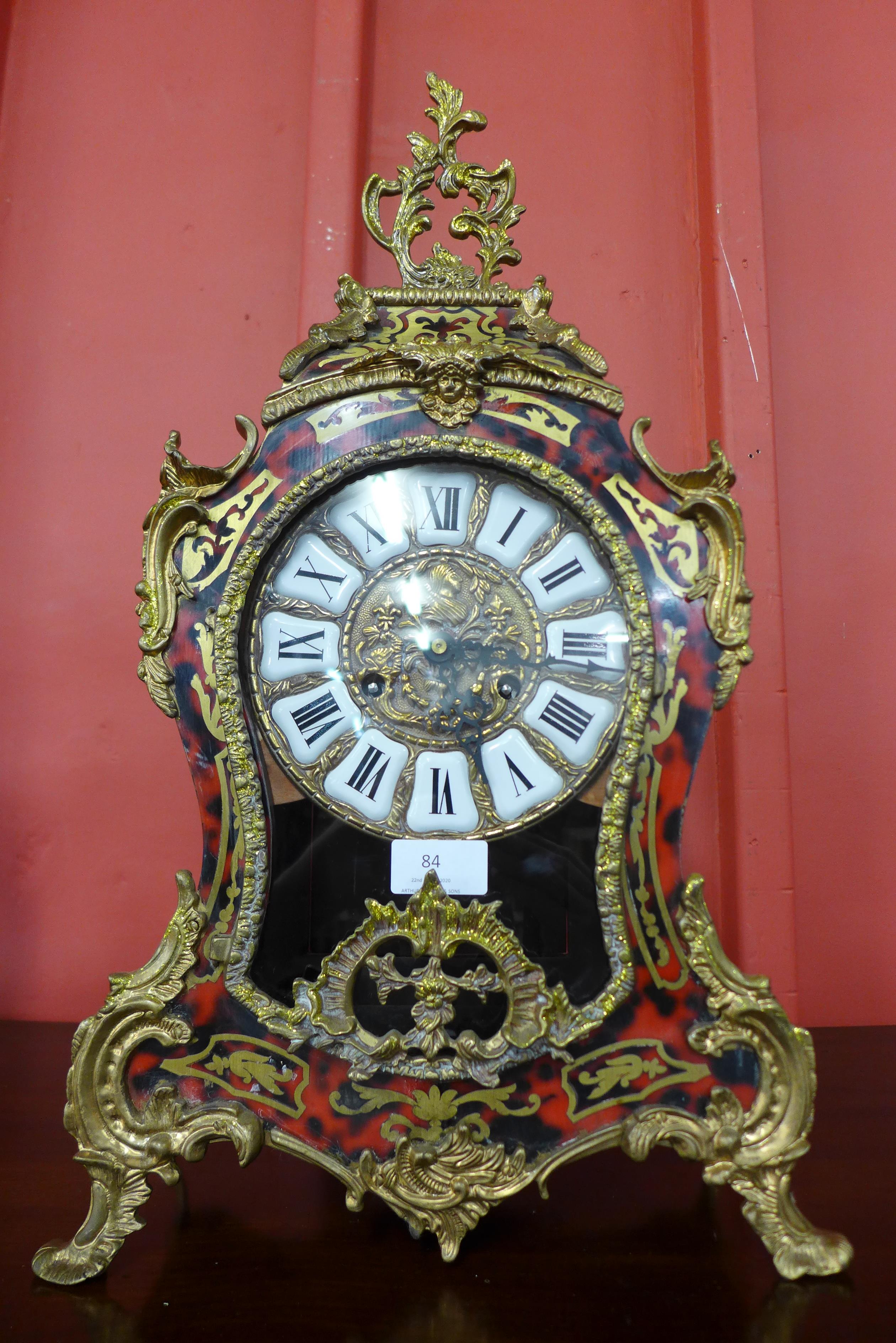 A Boulle style faux tortoiseshell and gilt metal clock, 56cms h