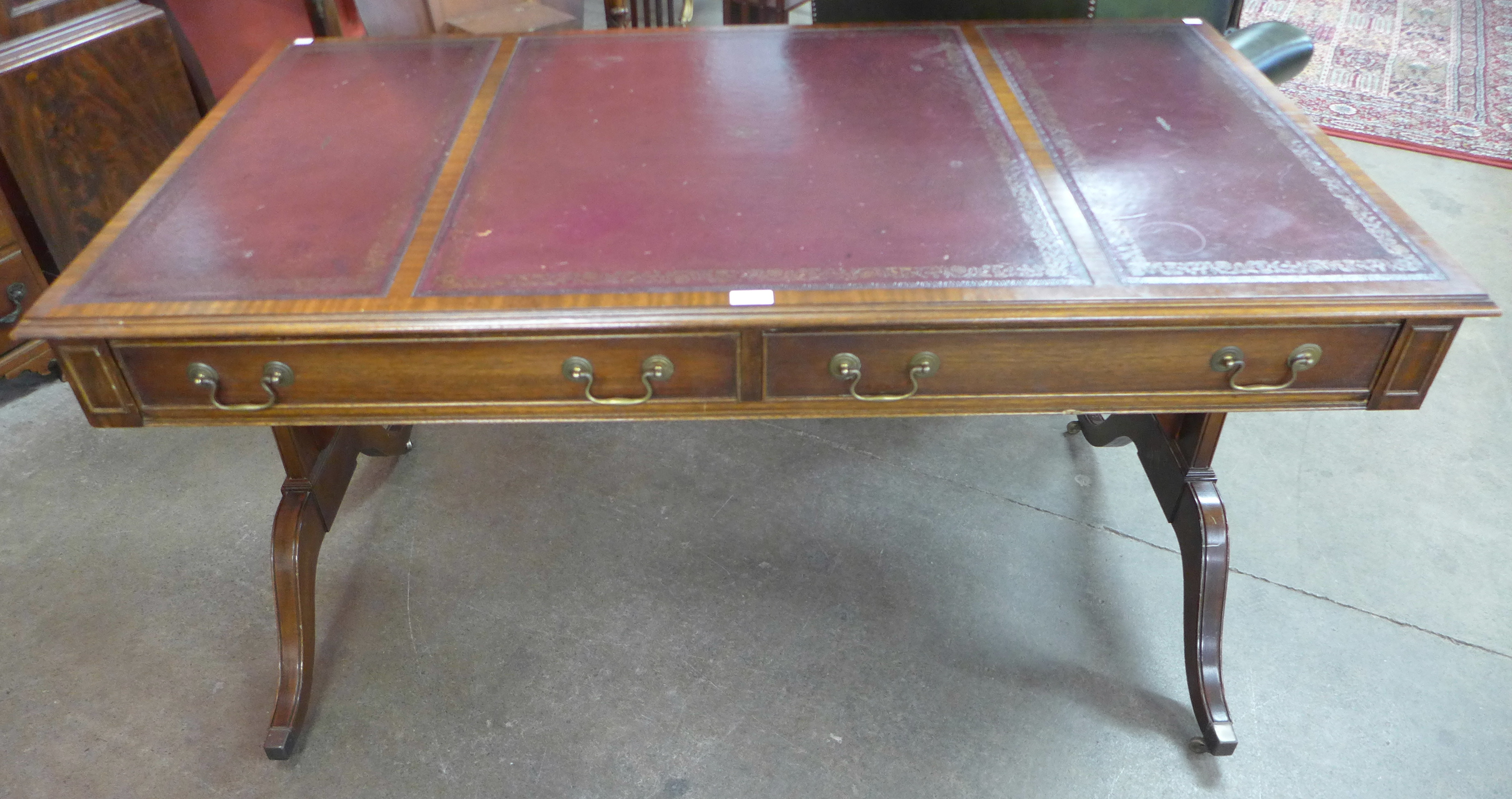 A Regency style mahogany and leather topped library table