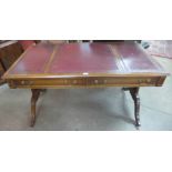 A Regency style mahogany and leather topped library table