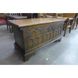 A 17th Century style carved oak blanket box