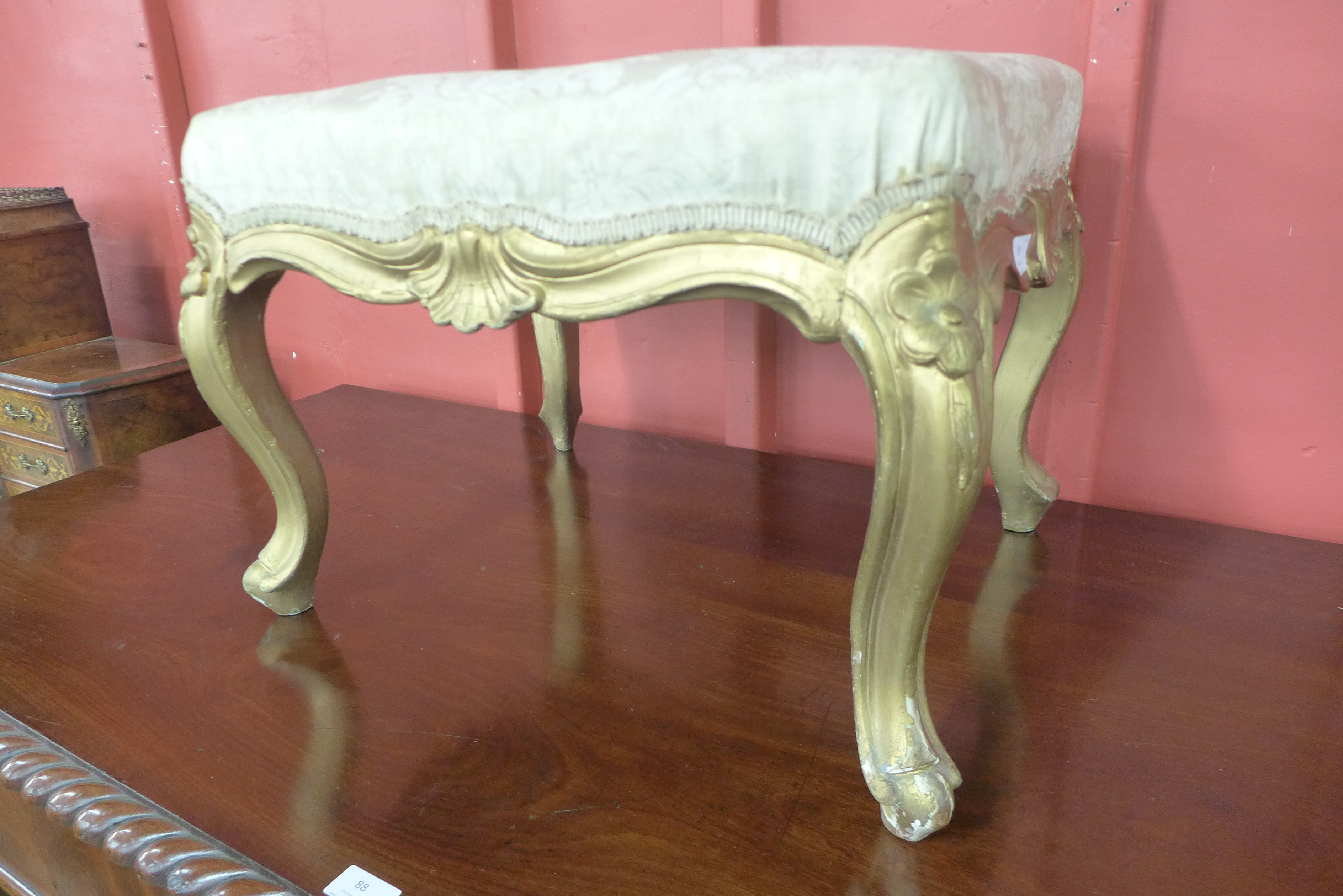 A French Louis XV style giltwood footstool