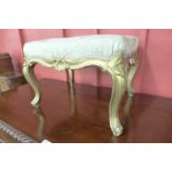 A French Louis XV style giltwood footstool