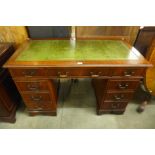 A mahogany pedestal desk