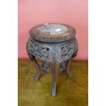 A Chinese marble topped padouk jardiniere stand, 47cms h