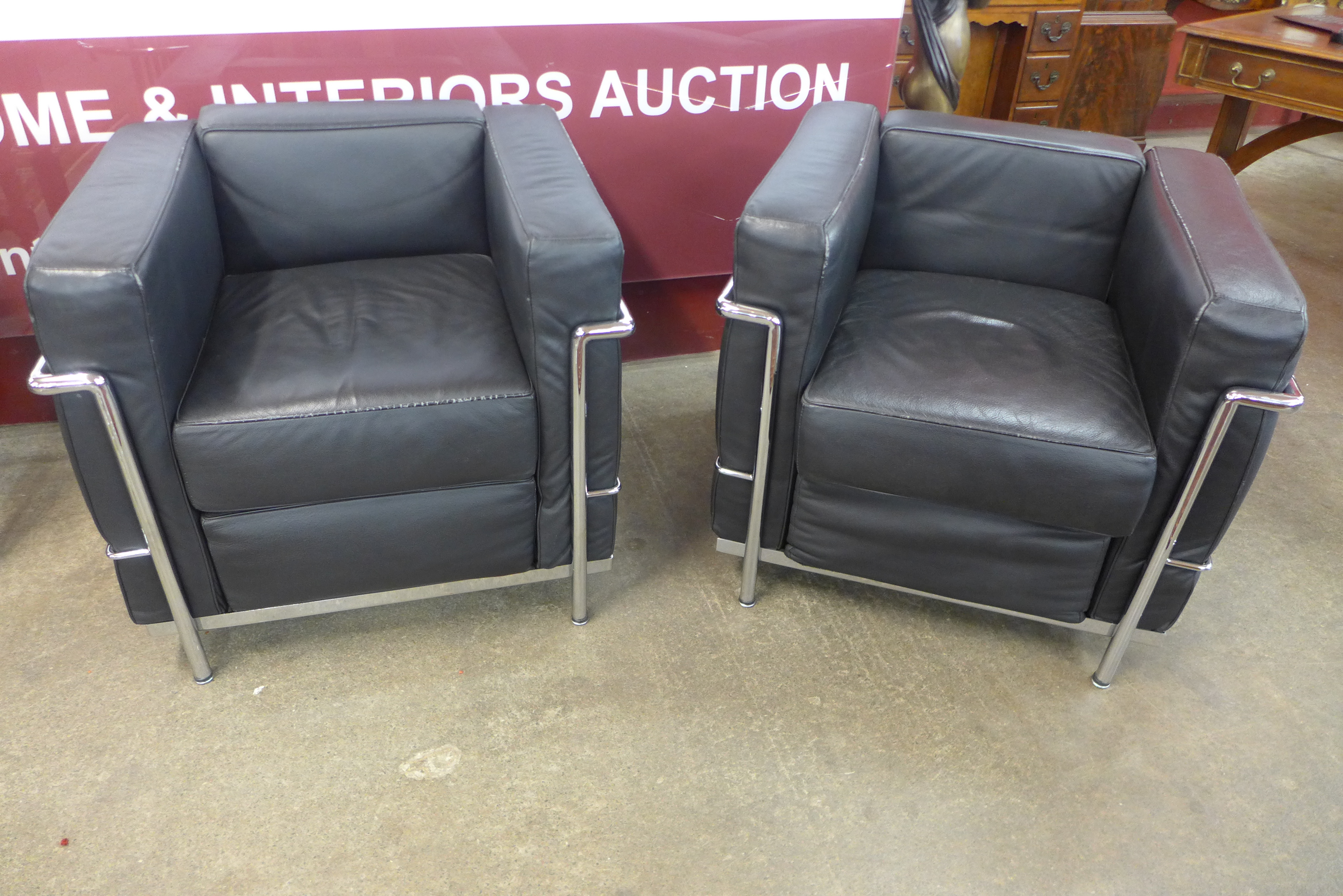 After Le Corbusier, a pair of chrome and black leather armchairs