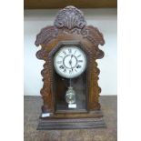 A 19th Century American Ansonia carved beech shelf clock