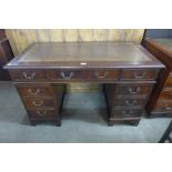 A mahogany pedestal desk