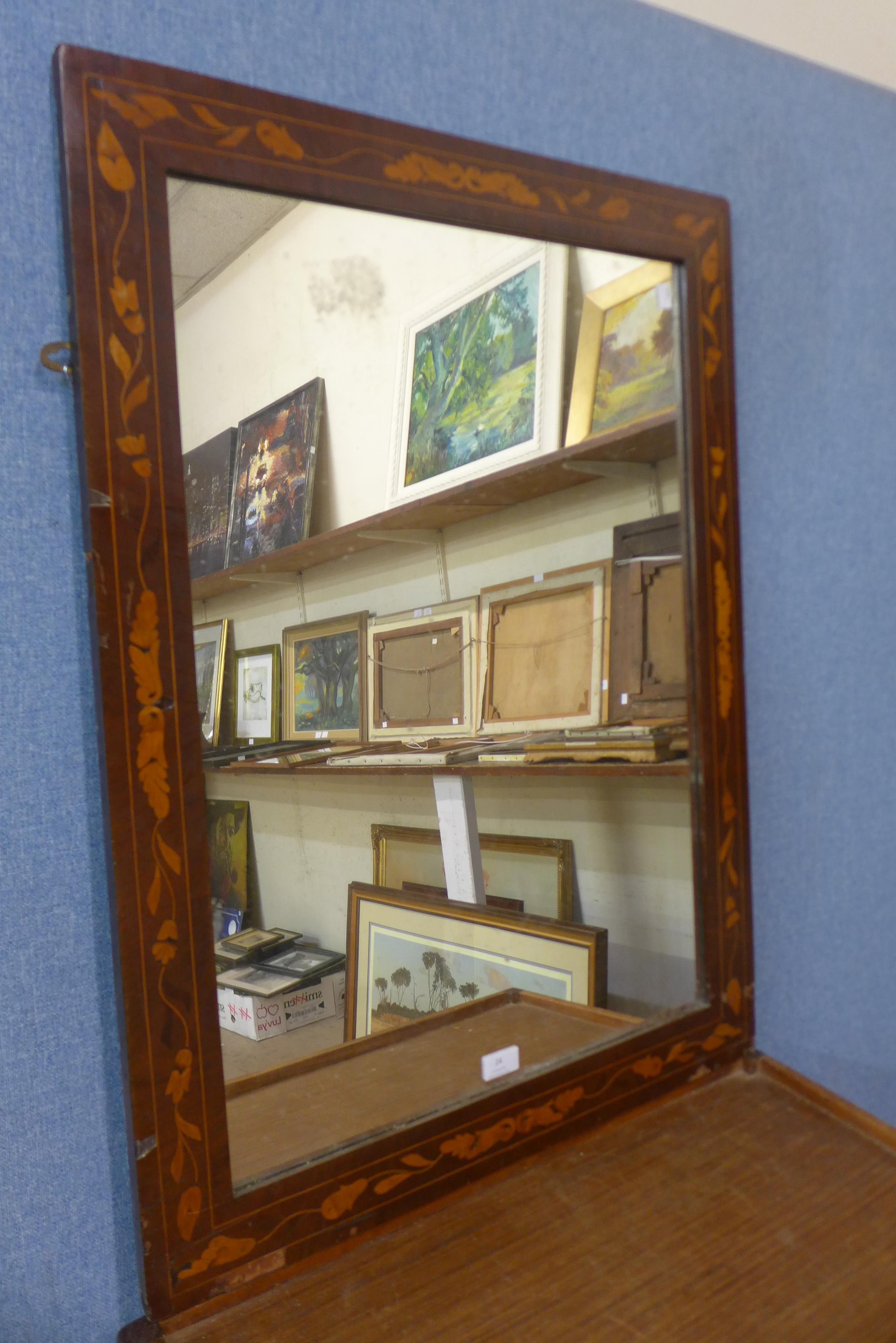 A 19th Century Dutch mahogany and marquetry inlaid mirror, 90 x 67cms