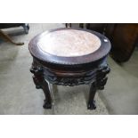 A Chinese marble topped padouk jardiniere stand