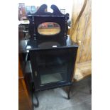 A Victorian ebonised side cabinet