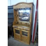 A pine tambour front wine/cocktail cabinet