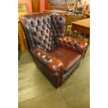 A red leather Chesterfield wingback armchair