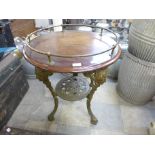 A mahogany and gilt metal pub table