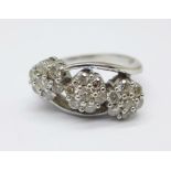An 18ct white gold and diamond cluster ring, approximate diamond weight 1carat, in three daisy
