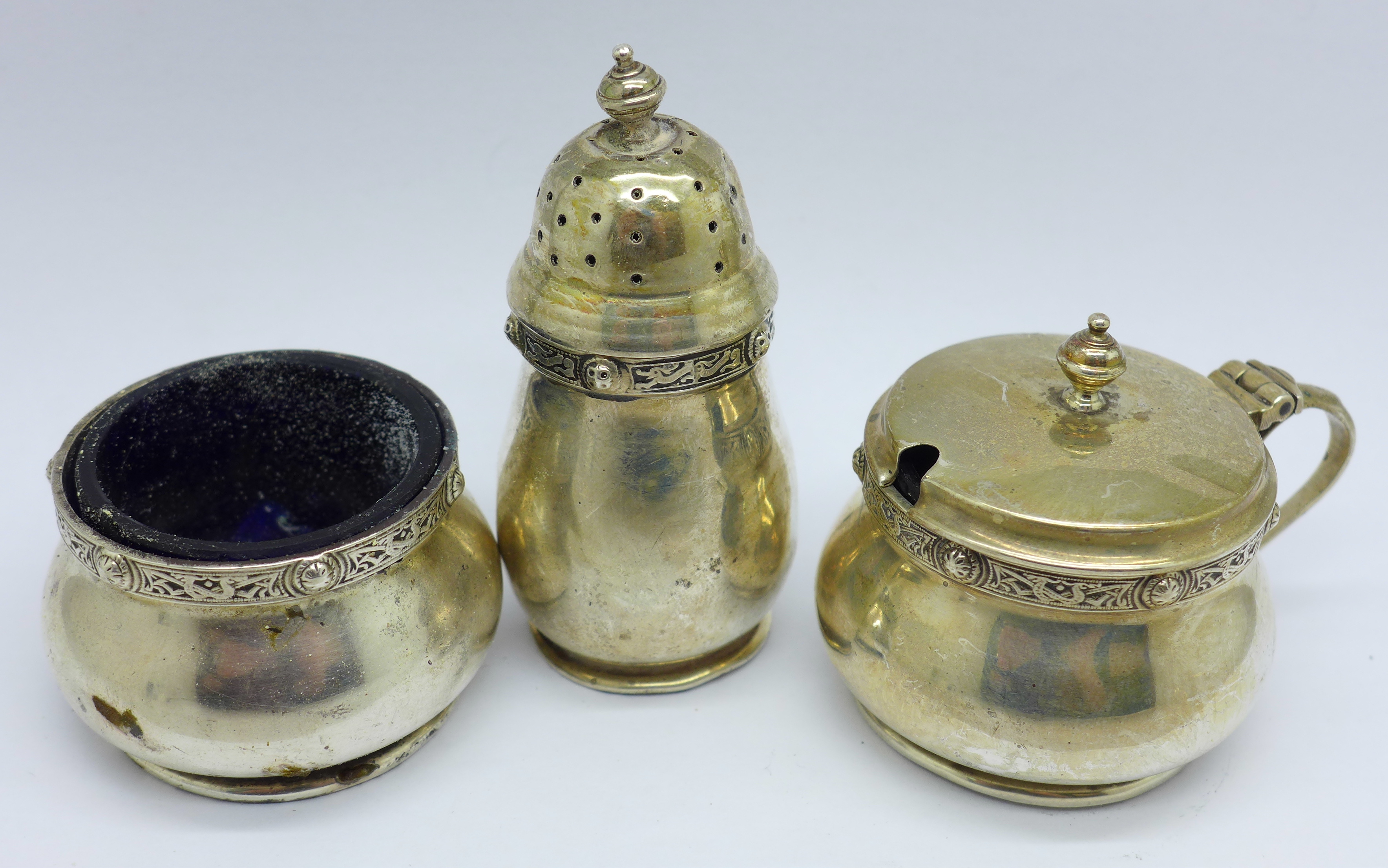A three piece silver cruet set by Goldsmiths & Silversmiths, a/f, 98g