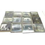 A box containing approximately sixty-eight magic lantern slides including Japanese, African
