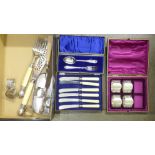 A pair of fish servers, a crumb scoop with silver ferrule, a cased christening set, napkin rings, (