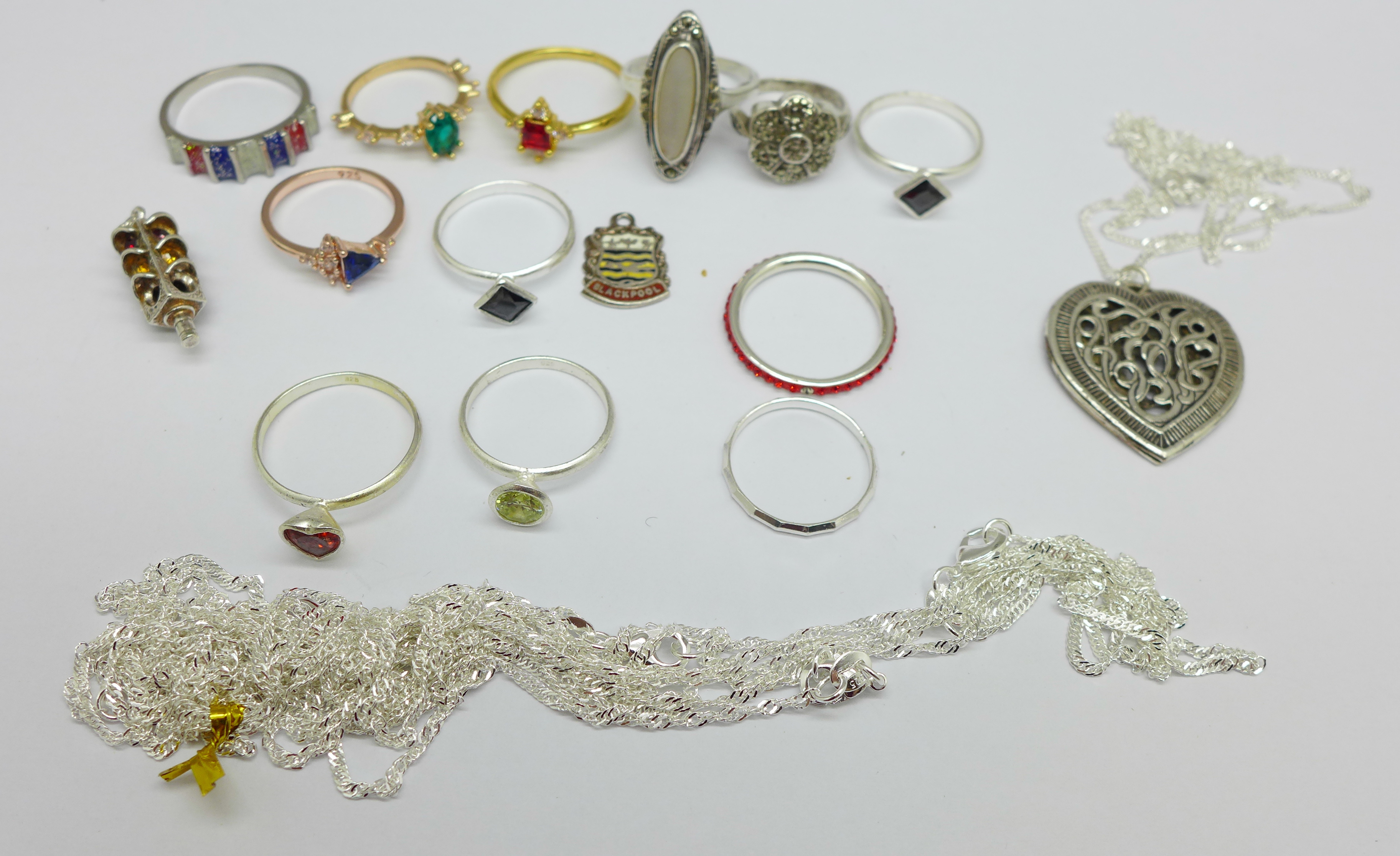 Jewellery; twelve ring, chains marked 925 and two charms